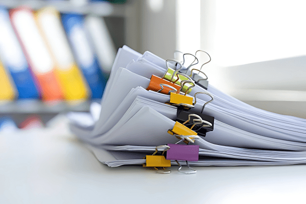 Eco-friendly copy paper neatly stacked on a table in a modern office space.